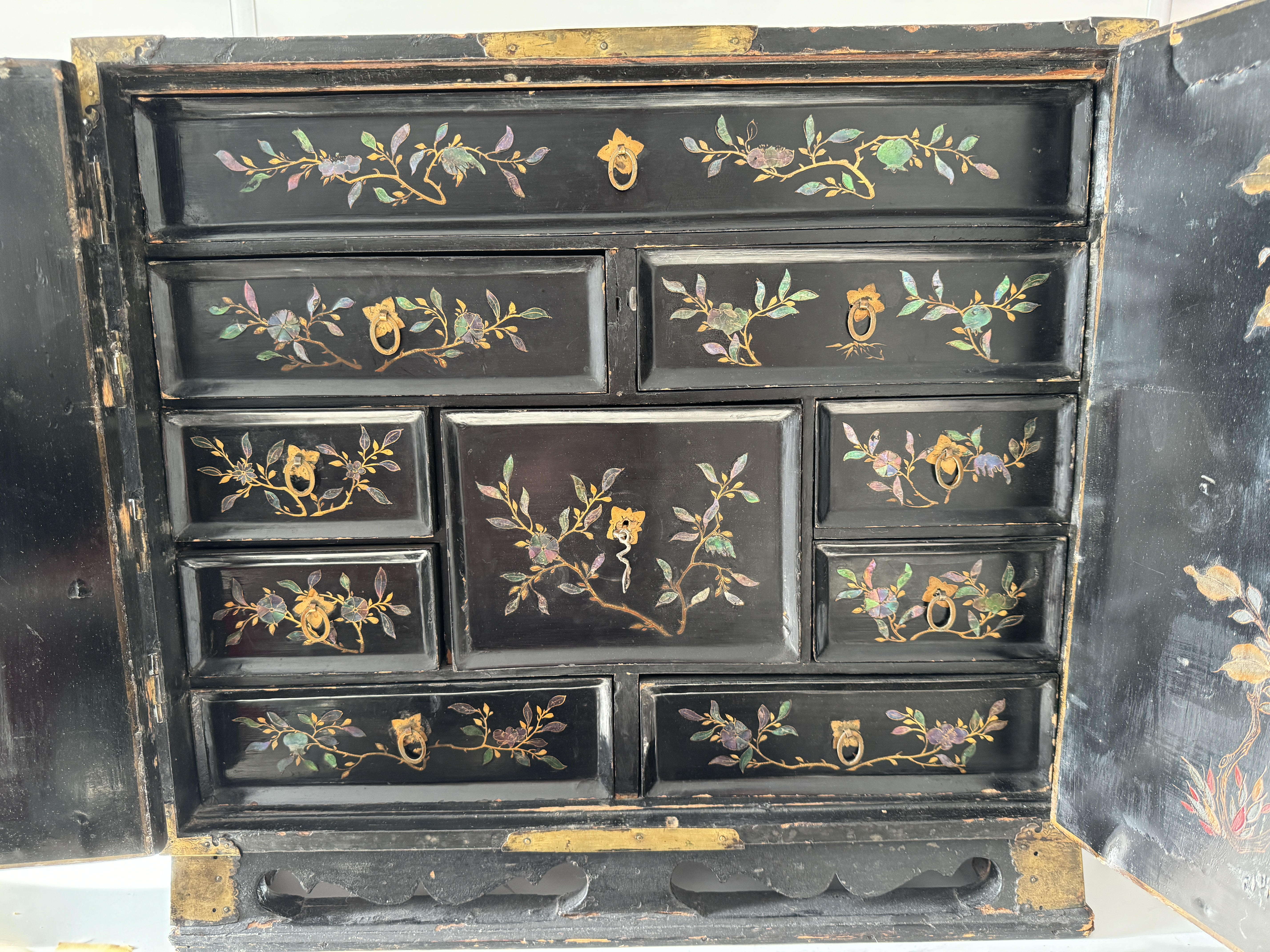 Two lacquered and mother-of-pearl-inlaid wood two-door cabinets. Southern China. Late 17th century